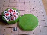 Korean chess: pieces in green plastic box and board